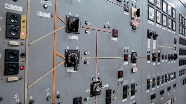Control panel at a power station. Buttons, switches and devices for controlling electricity. Old dashboard.