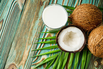 fresh natural coconut milk on wooden background