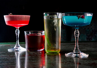 Cocktails glasses assortment served on dark background