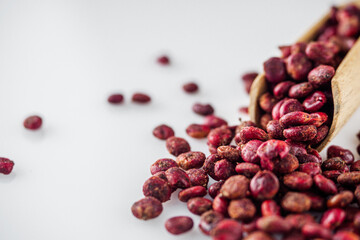 dry aromatic sumac spice on a white background