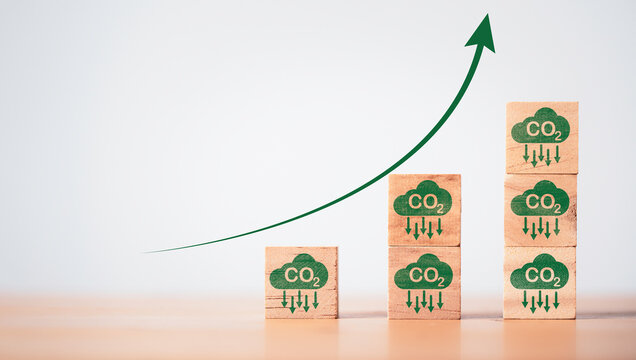 Stacking CO2 reducing icon with up arrow for decrease CO2 , carbon footprint and carbon credit to limit global warming from climate change, Bio Circular Green Economy concept.