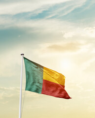 Waving Flag of Benin with beautiful Sky. 