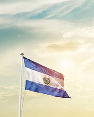 Waving Flag of El Salvador with beautiful Sky. 