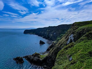 Stunning cliffs of Northern Ireland, where the emerald isle meets the North Atlantic Ocean - obrazy, fototapety, plakaty