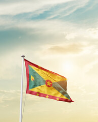 Waving Flag of Grenada with beautiful Sky. 