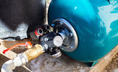Water supply system with a hydraulic tank and a cleaning filter from a well in the country.