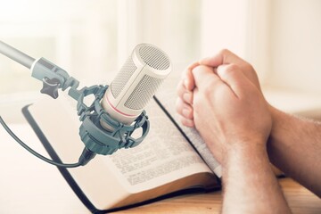 Christian concept. Bible book with microphone