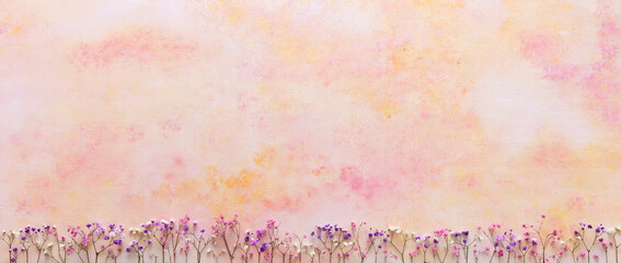 A pattern of yellow-red spots on a background with a lower edge of gypsophila flowers, also known...