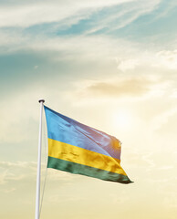 Waving Flag of Rwanda with beautiful Sky.