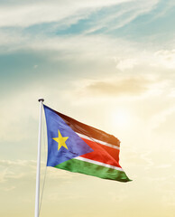 Waving Flag of South Sudan with beautiful Sky.