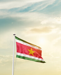Waving Flag of Suriname with beautiful Sky.