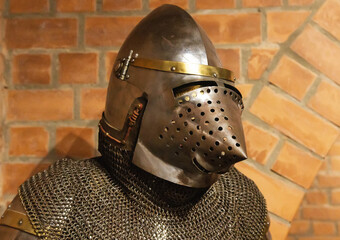 Protective old hundsgugel helmet from the 14th century used in Europe, close-up. 14th century. Dog muzzle helmet