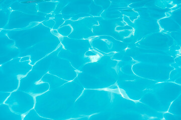 Water surface in sunlight, waves, splashes, water glare. natural natural abstract background