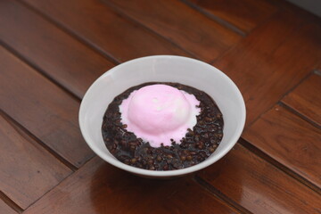 close up of a bowl of black sticky rice porridge