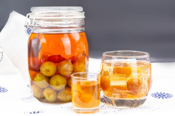 Glass of Japanese plum wine 'Umeshu',Japanese plum wine.Pickled plum wine.