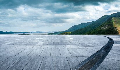 Empty square floor and mountain with sea natural landscape on a cloudy day