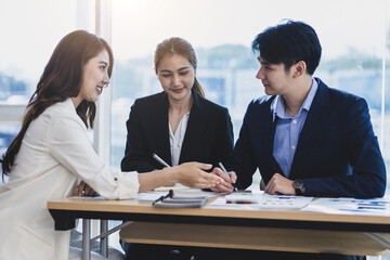 Business women meeting with colleagues to brainstorm corporate collaboration plans. Finance, Accounting and Investment Analysis
