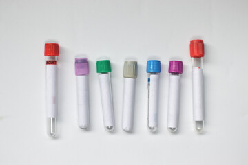 Empty blood sampling collection tubes of various types on white