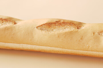 freshly baked baguette on table, close up 