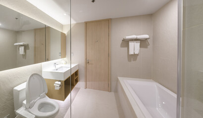 Loft white tile bathroom corner, tub and sink