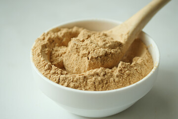 close up of brewers yeast flakes in container 