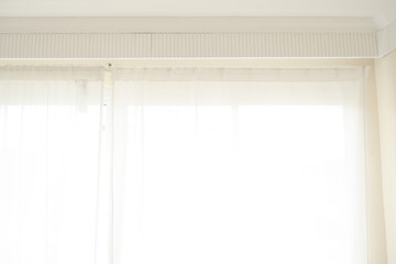 white curtain wavy with a pattern background. transparent curtain on the window