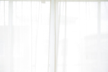 white curtain wavy with a pattern background. transparent curtain on the window