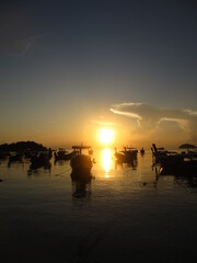 Fototapeta na wymiar Sunrise Among Boats