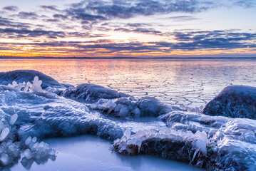 Sunset over the frozen sea. Pörkenäs, Finland
