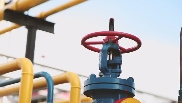 Large valve at a gas distribution station. Equipment of a gas power plant in close-up