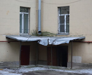 The inner corner of the house with the entrance to the basement