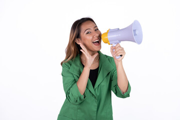 Young asian woman shouts into a megaphone. Isolated white background.