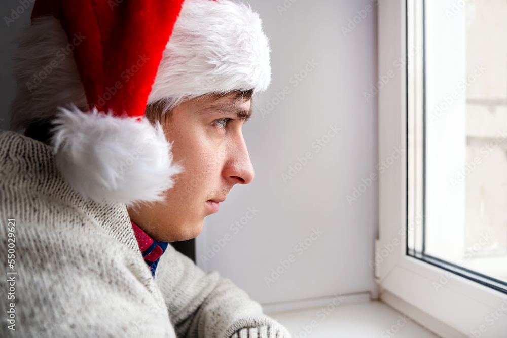 Canvas Prints sad young man in santa hat