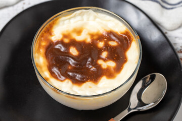 Rice Pudding on a white wood background. Turkish cuisine delicacies. close up
