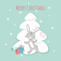 Cute New Year's rabbit near a white Christmas tree with gifts. Chinese character for 2023. Symbol of the year. Vector cartoon. Cartoon flat style. Lettering Merry Christmas.