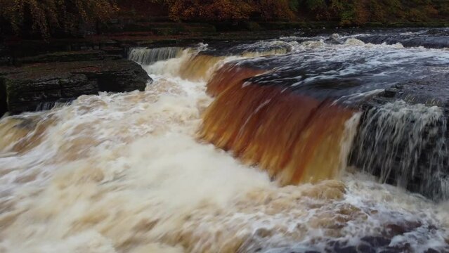 4k drone flight over Aysgarth Falls on River Ure in Wensleydale, Yorkshire Dales National Park