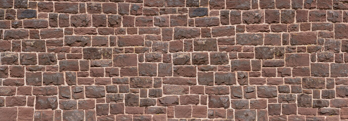 Alte Panorama Mauer aus rotem Sandstein - Nahaufnahme einer Kirchenmauer aus vielen viereckigen...