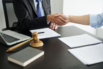 Lawyer with lawsuit meeting with client discussing with contract agreement at courtroom..