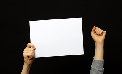 A sheet of white paper is held by a protester in China.