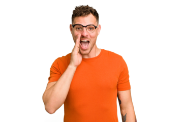 Young caucasian handsome man isolated shouts loud, keeps eyes opened and hands tense.