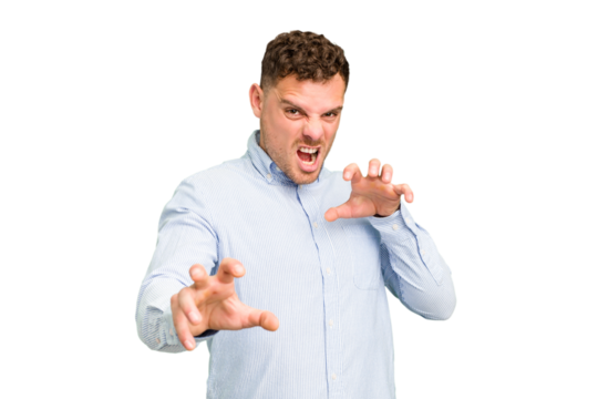 Young caucasian handsome man isolated showing claws imitating a cat, aggressive gesture.