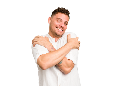 Young caucasian handsome man isolated hugs, smiling carefree and happy.