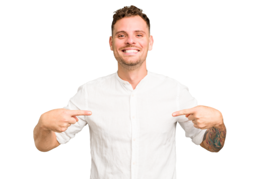 Young caucasian handsome man isolated person pointing by hand to a shirt copy space, proud and confident