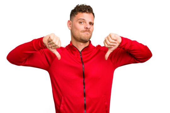 Young caucasian handsome man isolated showing thumb down, disappointment concept.