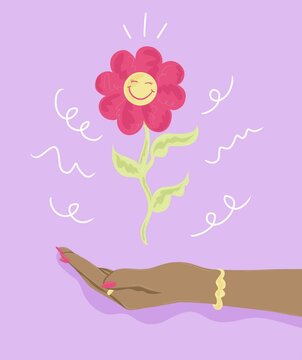 Hand holding up flower