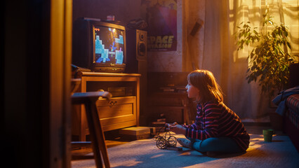 Nostalgic Childhood Concept: Young Girl Playing Old-School Arcade Video Game on a Retro TV Set at Home in Her Room with Period-Correct Interior. Successful Kid Passes Challenging Level and Wins.