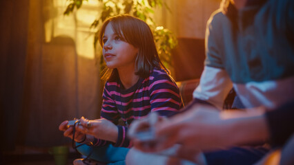 Close Up on Hands of Young Kids Intensely Playing Arcade Video Game on a Retro Console in a Living...