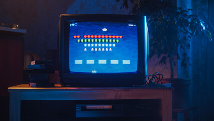 Close Up Footage of a Retro TV Set Screen with an 8 Bit 2D Eighties Inspired Console Arcade Video...