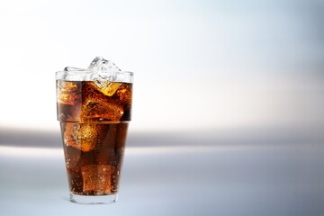 Tasty sweet drink in glass with ice