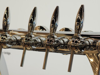 Row of polished beer taps - 550050666